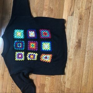 Sweater with crocheted patches